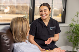 Nurse explaining infusion for autoimmune disease to patient